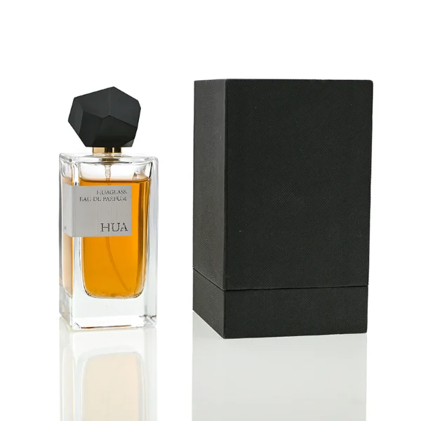 HUA0019 perfume bottle, heavy-base square cuboid glass bottle with clear finish, featuring a rectangular paper label and an eye-catching irregular multi-faceted rock-shaped plastic cap with a high-gloss white finish, elegant modern fragrance packaging design available in 30ml, 50ml, and 100ml