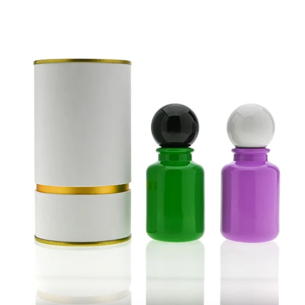 HUA0033 perfume bottle, apothecary-style round glass bottle with a solid opaque high-gloss color finish, featuring a spherical ball plastic cap with a smooth high-gloss shiny finish, elegant modern fragrance packaging design available in 30ml, 50ml, and 100ml