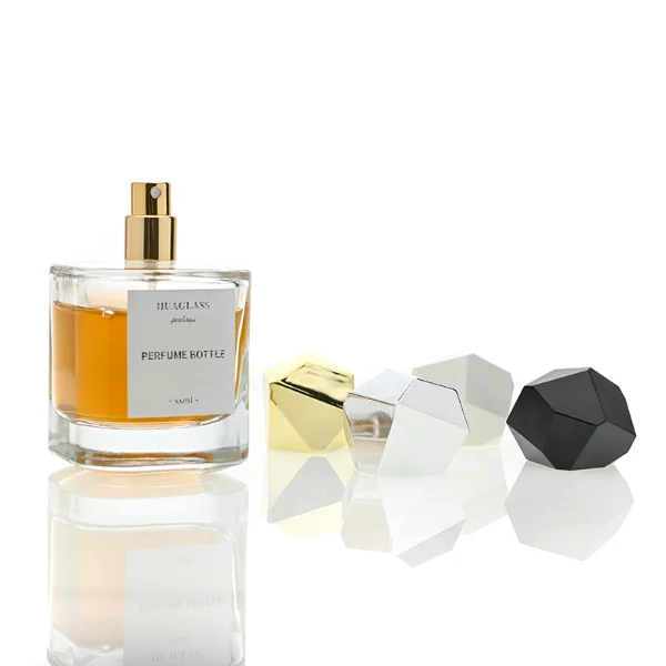 HUA0022 perfume bottle, heavy-base square cuboid glass bottle with clear finish, featuring a square paper label and an eye-catching irregular multi-faceted rock-shaped plastic cap with a high-gloss shiny finish and sharp geometric angles, elegant modern fragrance packaging design in 40ml