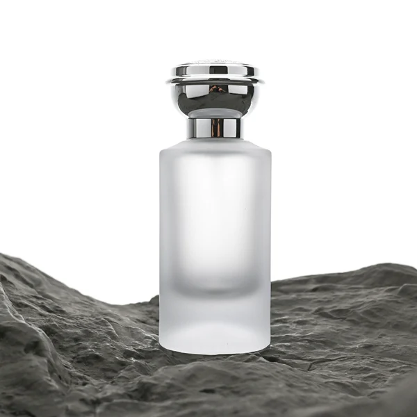 HUA0060 perfume bottle, heavy-base cylindrical round glass bottle with clear finish, featuring a matching neck and an ornate sculptural tiered crown plastic cap with a smooth high-gloss shiny finish, elegant modern fragrance packaging design available in 30ml, 50ml, and 100ml