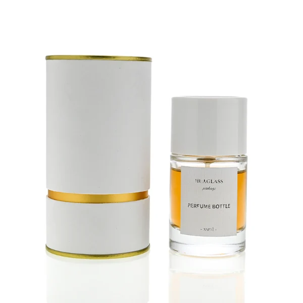 HUA0021 perfume bottle, heavy-base cylindrical round glass bottle with clear finish, featuring a square paper label, a matching neck, and a tall cylindrical plastic cap with a smooth high-gloss shiny finish, elegant modern fragrance packaging design available in 30ml, 50ml, and 100ml