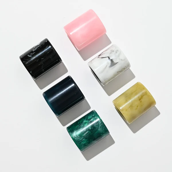 HUA0001 perfume bottle, heavy-base rectangular cuboid glass bottle with clear finish, featuring a square paper label, a matching neck, and a tall cylindrical synthetic polymer cap with an organic marbled or solid glossy finish, elegant modern fragrance packaging design available in 30ml, 50ml, and 100ml