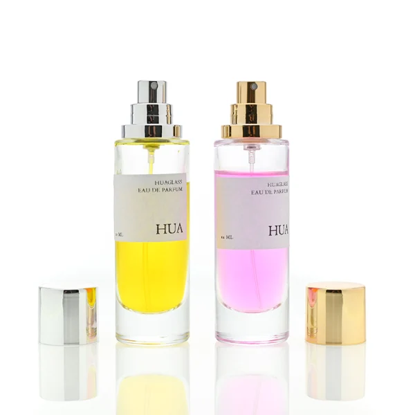 HUA0056 perfume bottle, heavy-base tall slender cylindrical round glass bottle with clear finish, featuring a wide wrapped paper label, a matching neck, and a tall cylindrical plastic cap with a smooth high-gloss shiny finish, elegant modern fragrance packaging design available in 30ml, 50ml, and 100ml