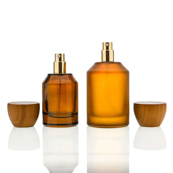 HUA0050 perfume bottle, cylindrical round glass bottle with multi-angled sloping beveled shoulders in solid high-gloss opaque black, clear amber, or frosted amber finish, featuring an eye-catching inverted conical cup-shaped wood cap with prominent natural wood grain lines, modern fragrance packaging design available in 30ml, 50ml, and 100ml
