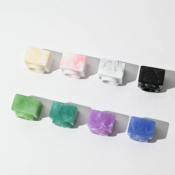 HUA0030 perfume bottle, heavy-base rectangular cuboid glass bottle with clear finish, featuring a matching neck, and a low-profile cylindrical resin cap with a colorful marbled finish, elegant modern fragrance packaging design available in 30ml, 50ml, and 100ml