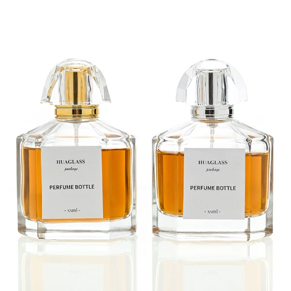HUA0011 perfume bottle, luxury heavy-base polyhedral faceted glass bottle with high-transparency clear finish, featuring a square paper label and a brilliant multi-faceted crystalline acrylic plastic crown cap with a metallic inner core, elegant classic fragrance packaging design in 100ml