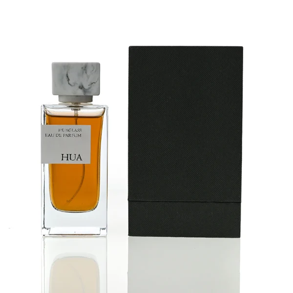 HUA0040 perfume bottle, heavy-base rectangular cuboid glass bottle with clear finish, featuring a side-aligned square paper label and a short rectangular block-shaped resin cap with an eye-catching marbled texture, elegant modern fragrance packaging design available in 15ml, 30ml, 50ml, and 100ml