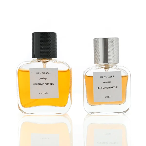 HUA0052 perfume bottle, heavy-base clear flattened oval flask glass bottle, featuring a square paper label and a tall cylindrical plastic cap with a smooth high-gloss shiny finish, elegant modern fragrance packaging design available in 30ml, 50ml, and 100ml