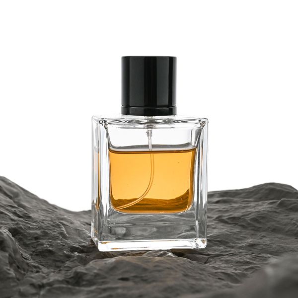 HUA0065 perfume bottles, rectangular clear glass with gold and black metallic caps, amber liquid, modern elegant design, 35ml 50ml 100ml.