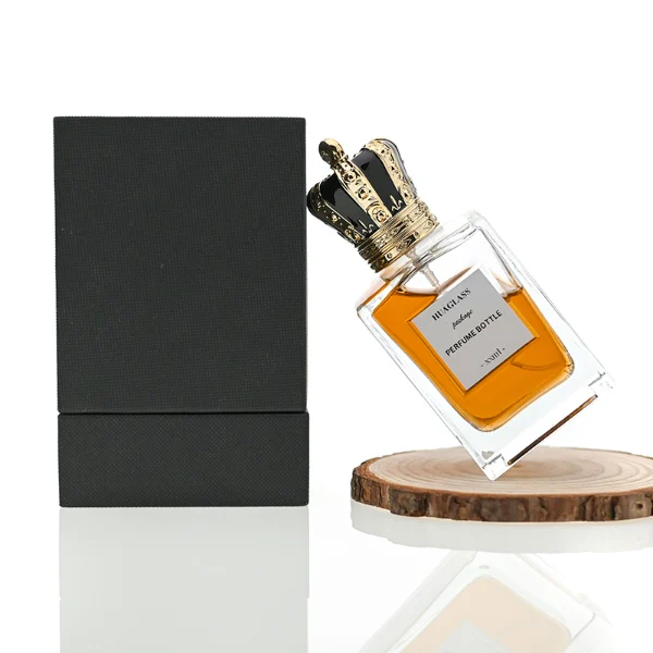 HUA0066 perfume bottles, rectangular clear glass with irregular black plastic caps, amber liquid, modern elegant design, 50ml 100ml.