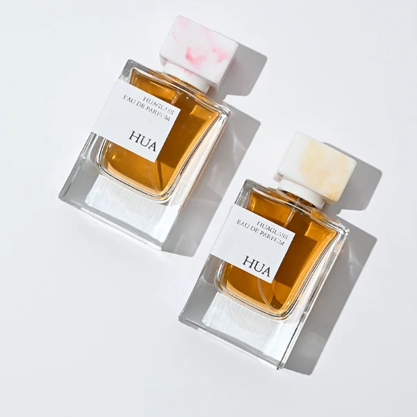 HUA0067 50ml perfume bottle, rectangular clear glass with rectangular colorful plastic cap, amber liquid, modern artistic design.