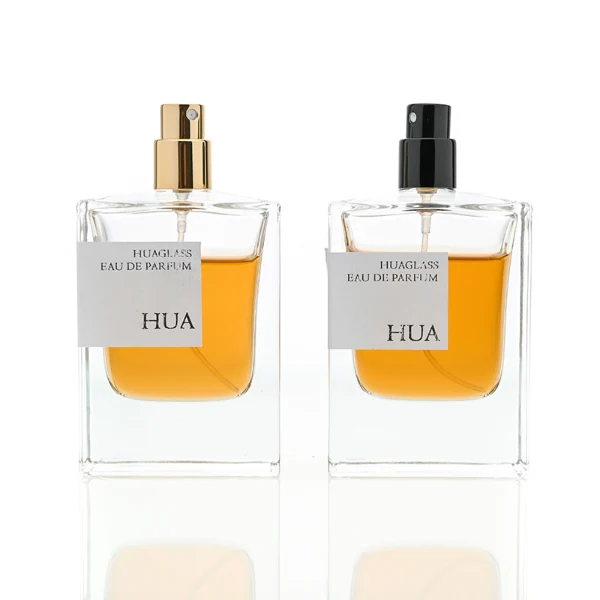 HUA0067 50ml perfume bottle, rectangular clear glass with rectangular colorful plastic cap, amber liquid, modern artistic design.