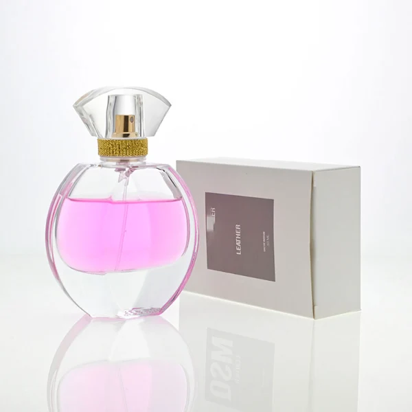 HUA0069 perfume bottles, oval clear glass with faceted plastic caps in silver/gold tones, amber and pink liquids, modern elegant design, 30ml 50ml 100ml.