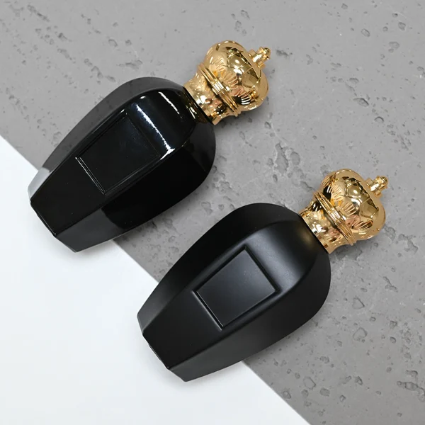 HUA0071 perfume bottle, black curved glass with gold crown-shaped zinc-aluminum alloy cap, rectangular front panel, luxurious classic design, available in 30 ml, 50 ml, and 100 ml