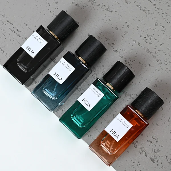 HUA0073 perfume bottle, rectangular colored glass with liquid, black wooden ring-shaped cap, modern luxurious design, available in 30 ml, 50 ml, and 100 ml