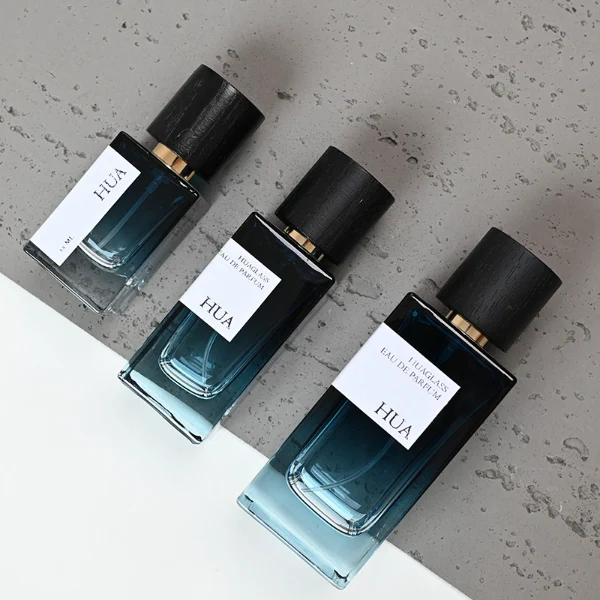 HUA0073 perfume bottle, rectangular colored glass with liquid, black wooden ring-shaped cap, modern luxurious design, available in 30 ml, 50 ml, and 100 ml