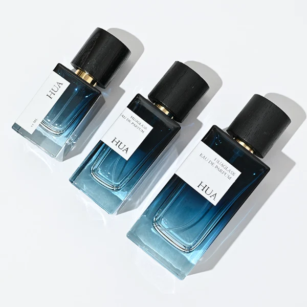 HUA0073 perfume bottle, rectangular colored glass with liquid, black wooden ring-shaped cap, modern luxurious design, available in 30 ml, 50 ml, and 100 ml