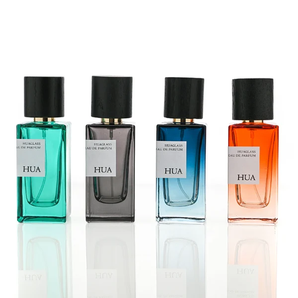 HUA0073 perfume bottle, rectangular colored glass with liquid, black wooden ring-shaped cap, modern luxurious design, available in 30 ml, 50 ml, and 100 ml
