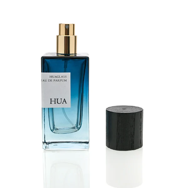 HUA0073 perfume bottle, rectangular colored glass with liquid, black wooden ring-shaped cap, modern luxurious design, available in 30 ml, 50 ml, and 100 ml