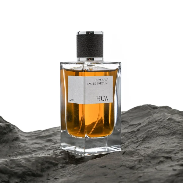HUA0075 perfume bottle, rectangular clear glass, plastic cap with leather overlay, modern luxurious design, available in 30 ml, 50 ml, and 100 ml