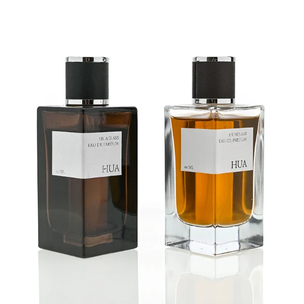 HUA0075 perfume bottle, rectangular clear glass, plastic cap with leather overlay, modern luxurious design, available in 30 ml, 50 ml, and 100 ml