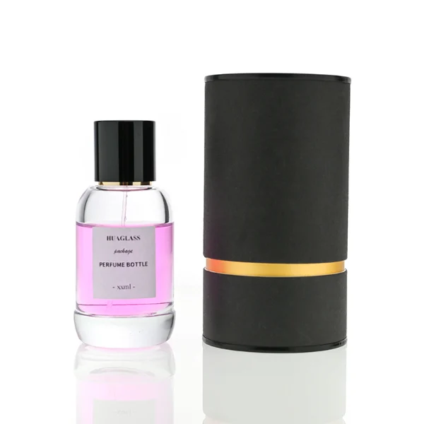 HUA0077 perfume bottle, rounded clear glass with liquid, glossy black aluminum magnetic cap, modern elegant design, available in 50 ml and 100 ml