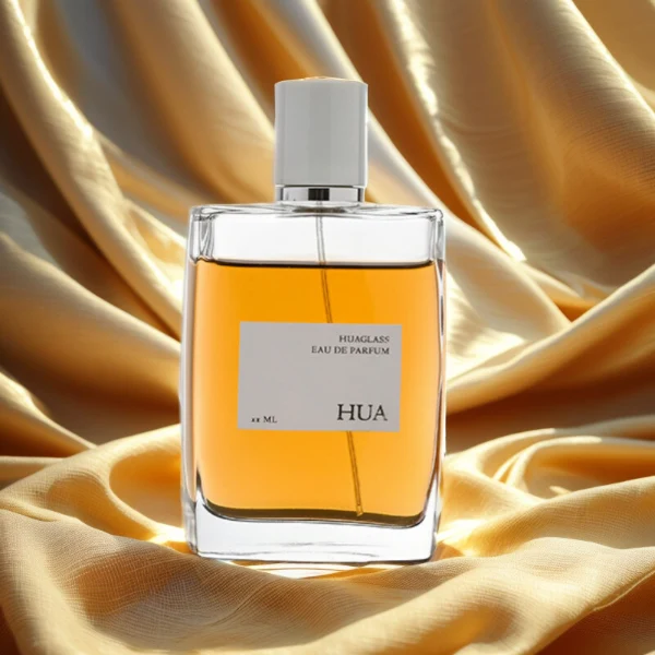 HUA0081 perfume bottle, square clear glass, glossy white cylindrical plastic cap with yellow or silver ring, modern elegant design, available in 100 ml