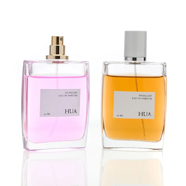 HUA0081 perfume bottle, square clear glass, glossy white cylindrical plastic cap with yellow or silver ring, modern elegant design, available in 100 ml