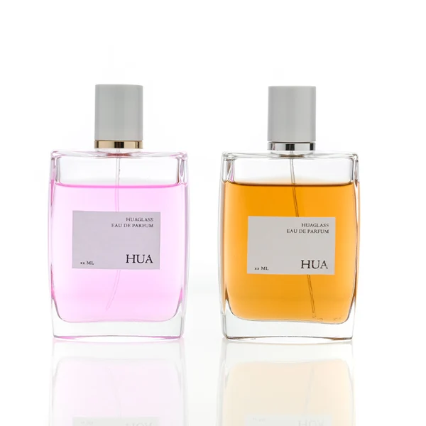 HUA0081 perfume bottle, square clear glass, glossy white cylindrical plastic cap with yellow or silver ring, modern elegant design, available in 100 ml