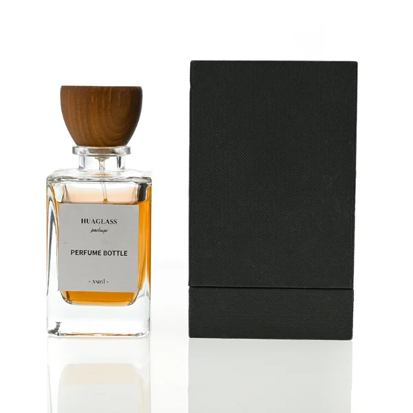 HUA0083 perfume bottle, square clear glass, wooden stopper-style cap, modern elegant design, available in 30 ml, 50 ml, and 100 ml