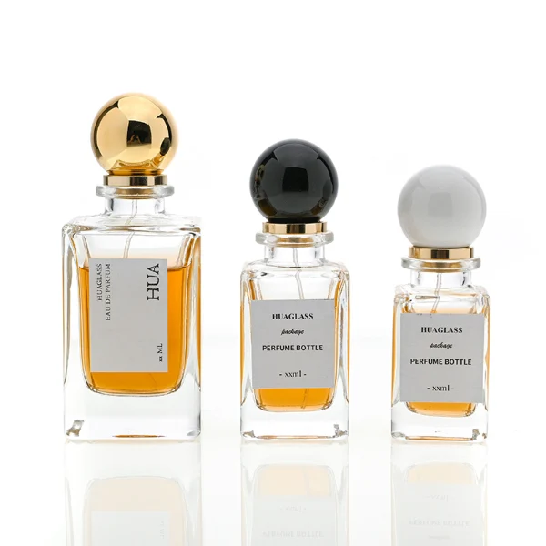 HUA0084 perfume bottle, rectangular  glass with liquid, glossy plastic spherical cap, modern elegant design, available in 30 ml, 50 ml, and 100 ml