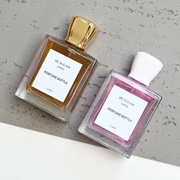 HUA0086 perfume bottle, square glass with liquid, glossy tapered plastic cap, modern elegant design, available in 30 ml, 50 ml, and 100 ml