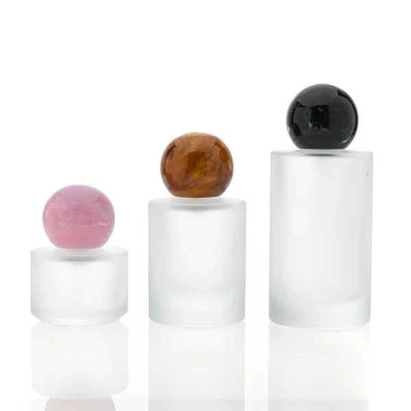 HUA0091 perfume bottle, cylindrical frosted white glass with liquid, colorful synthetic resin spherical cap, modern elegant design, available in 30 ml, 50 ml, and 100 ml