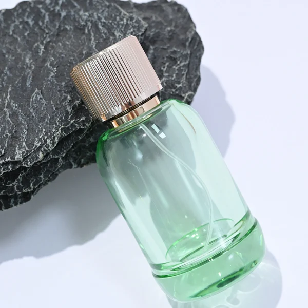 HUA0094 perfume bottle, cylindrical glass, aluminum ribbed cylindrical cap, modern elegant design, available in 50 ml and 100 ml