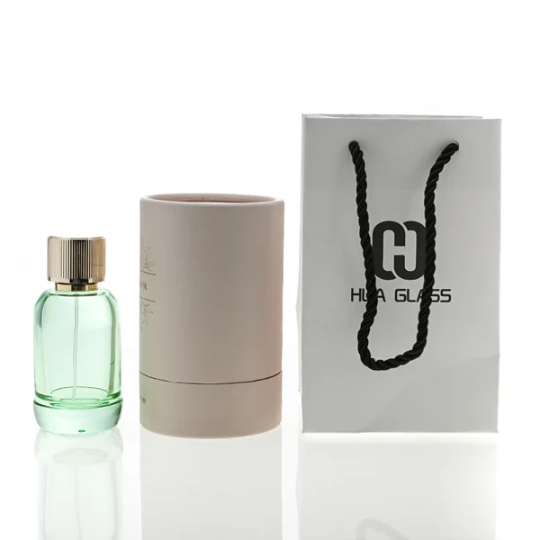 HUA0094 perfume bottle, cylindrical glass, aluminum ribbed cylindrical cap, modern elegant design, available in 50 ml and 100 ml