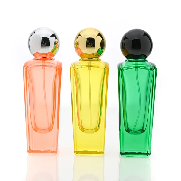 HUA0095 perfume bottle, tall rectangular colored glass body with embossed side details, glossy spherical plastic cap, modern artistic design, available in 50 ml.