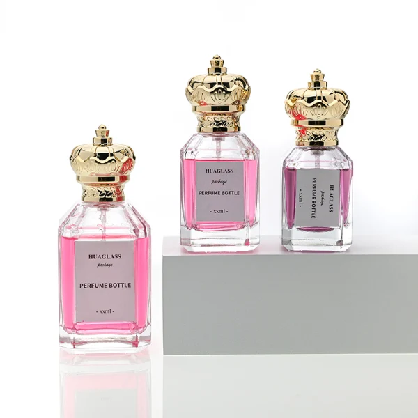 HUA0099 perfume bottle, faceted clear glass with liquid, glossy crown-shaped plastic cap, modern elegant design, available in 50 ml and 75 ml