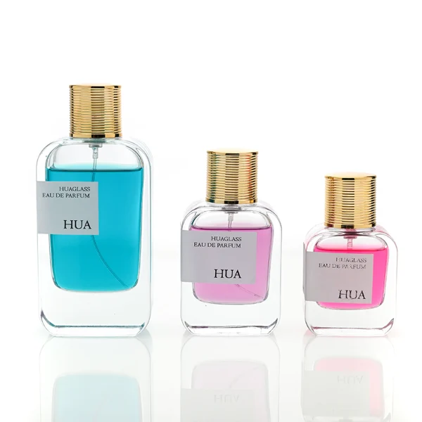 HUA0104 perfume bottle, rounded rectangular glass body with liquid and outer HUA label, cylindrical plastic cap with layered ring texture, modern elegant design, available in 30 ml, 50 ml, and 100 ml.