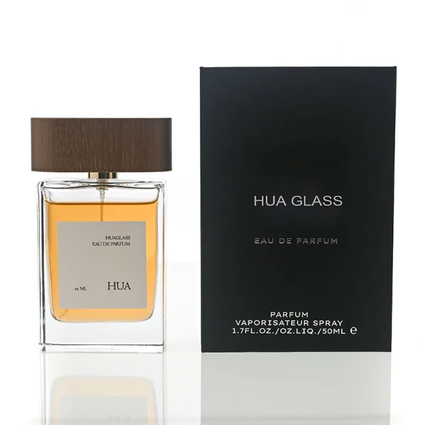HUA0107 perfume bottle, rectangular glass body with liquid, wide flat wooden cap with metallic-finished neck, modern minimalist design, available in 50 ml and 100 ml.