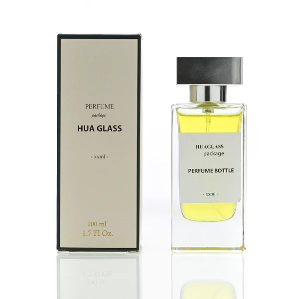 HUA0113 perfume bottle, tall rectangular clear glass body with liquid and outer label, rectangular plastic cap in black or gold, modern elegant design, available in 30 ml, 50 ml, and 100 ml.