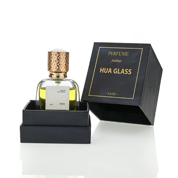 HUA0115 perfume bottle, rounded rectangular glass body with outer label, plastic cap with yellow engraved patterns, modern elegant design, available in 30 ml, 50 ml, and 100 ml.