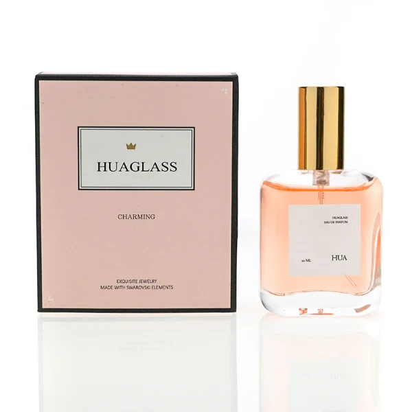 HUA0117 perfume bottle, rounded rectangular clear glass body with outer label, colored aluminum cylindrical cap in black, silver, or gold, modern minimalist design, available in 30 ml.