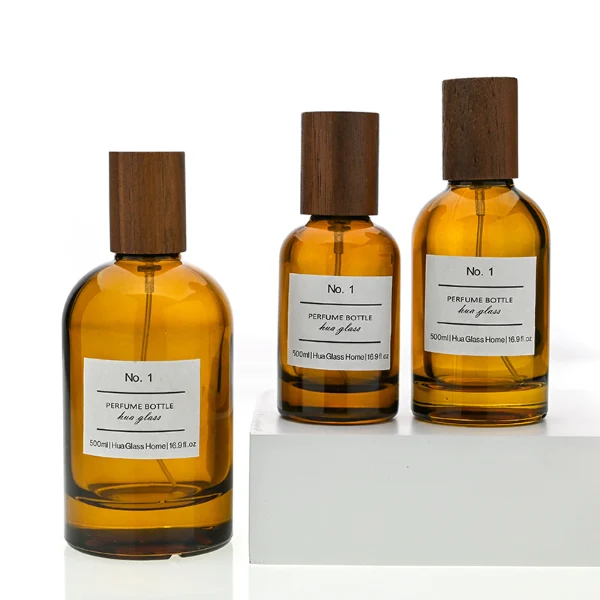 HUA0120 perfume bottle, amber cylindrical glass with outer label, tall wooden cylindrical cap, minimalist contemporary design, available in 30 ml, 50 ml, and 100 ml