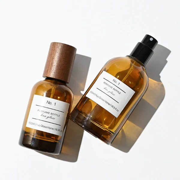 HUA0120 perfume bottle, amber cylindrical glass with outer label, tall wooden cylindrical cap, minimalist contemporary design, available in 30 ml, 50 ml, and 100 ml