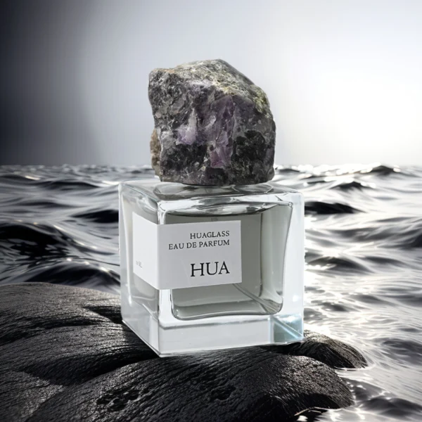 HUA0124 perfume bottle, square clear glass with outer label, irregular crystal stone cap with natural raw texture, contemporary decorative design, available in 30 ml, 50 ml, and 100 ml