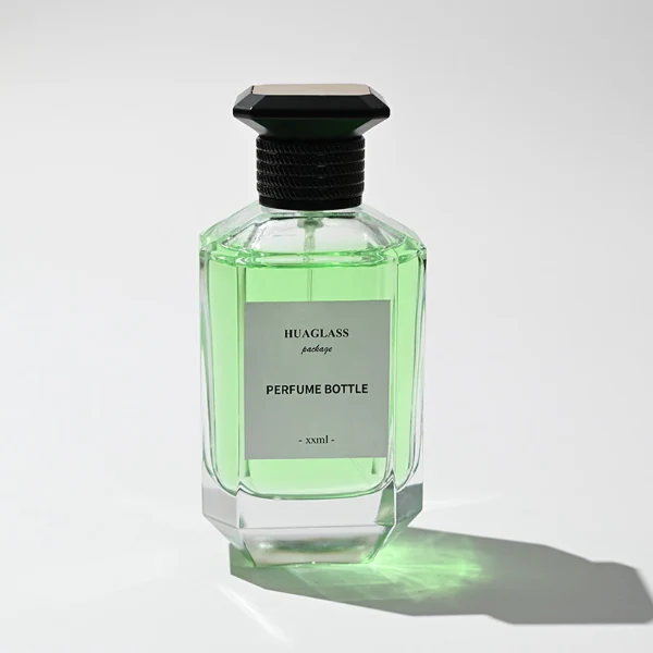 HUA0126 perfume bottle, faceted rectangular clear glass body with liquid, square resin cap, printed logo, contemporary elegant design, available in red, green, yellow, ideal for gifting and daily use.