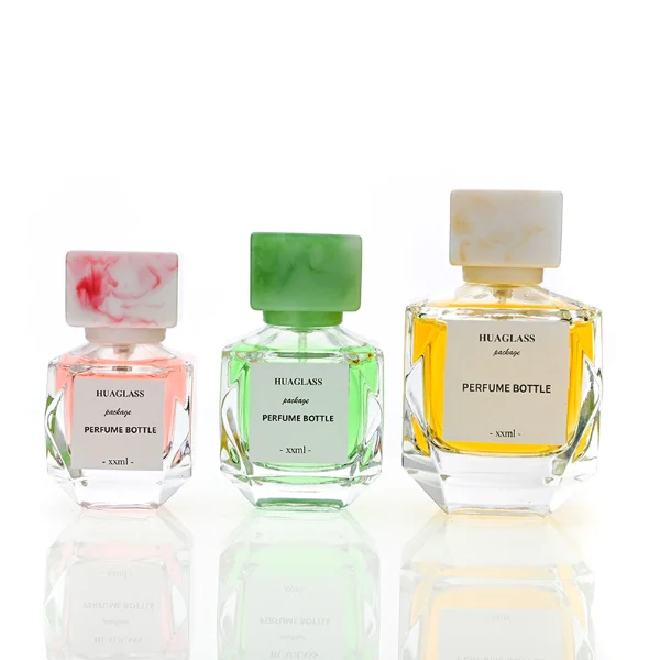 HUA0126 perfume bottle, faceted rectangular clear glass body with liquid, square resin cap, printed logo, contemporary elegant design, available in red, green, yellow, ideal for gifting and daily use.