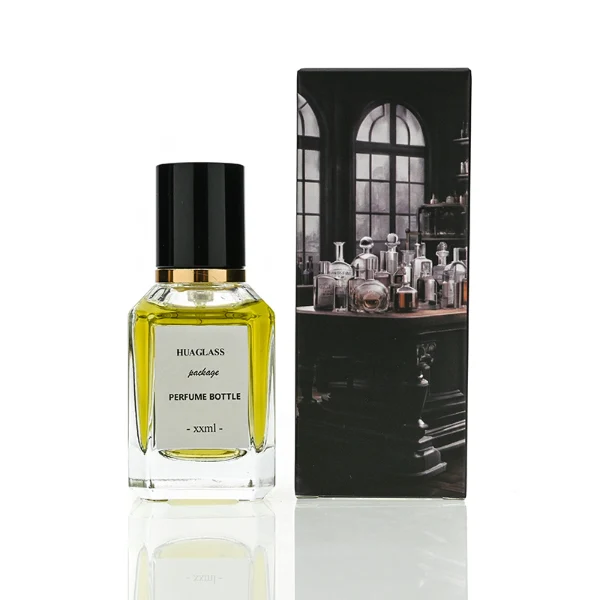 HUA0135 perfume bottle, rectangular clear glass body with 30 ml, 50 ml, or 100 ml liquid, cylindrical plastic cap with gold metallic neck, outer label with printed logo, modern elegant design, ideal for gifting and daily use.