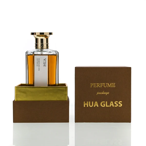 HUA0140 perfume bottle, hexagonal clear glass body with 50 ml or 100 ml liquid, Zamac cap with conical funnel top and cylindrical base with ring detailing, outer label with printed logo, modern elegant design, ideal for gifting and daily use.