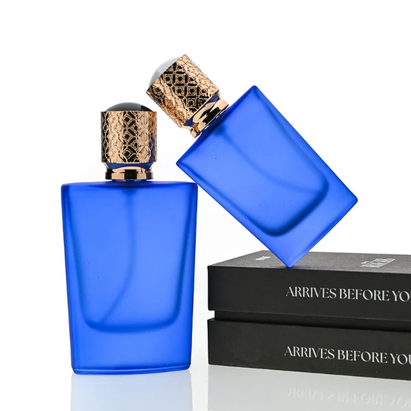 HUA0146 perfume bottle, rectangular frosted opaque glass body with 30 ml or 50 ml liquid, cylindrical plastic cap with gold carved patterns, outer label with printed logo, modern elegant design, ideal for gifting and daily use.